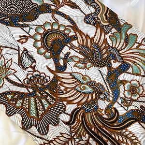 May include: White fabric with a brown, blue, and green batik pattern featuring a stylized bird and floral designs.