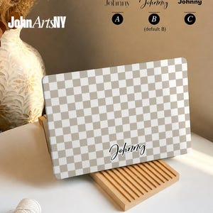 May include: A laptop case featuring a beige and white checkered pattern with the name Johnny printed in a black script font. Above the case, text reads Personalize Your Case with three font options labeled A, B, and C, and JohnArtsNY logo.