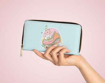 May include: A light blue zippered wallet with a retro roller skate design. The skate is pink and orange with a white flower on it. There are stars and a pink circle around the skate.