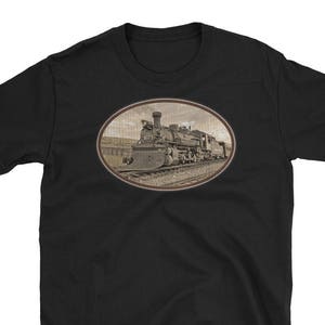 May include: Black t-shirt with a vintage-style image of a steam locomotive train in a circular frame.
