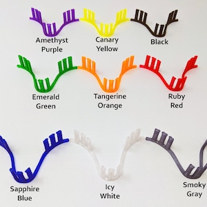 May include: A set of 10 colorful plastic hair clips in various colors, including amethyst purple, canary yellow, black, emerald green, tangerine orange, ruby red, sapphire blue, icy white, and smoky gray.