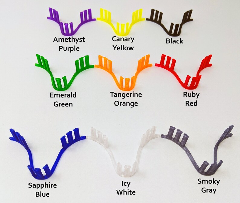May include: A set of 10 colorful plastic hair clips in various colors, including amethyst purple, canary yellow, black, emerald green, tangerine orange, ruby red, sapphire blue, icy white, and smoky gray.