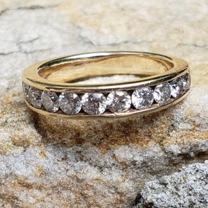 0,94 ct diamantjubileumsring / kanalfattad diamantjubileumsring / diamantvigselring bild 1