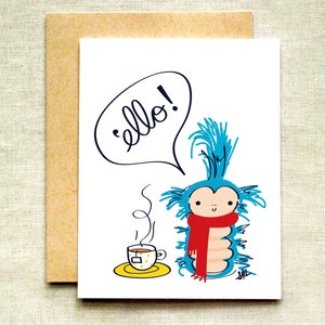 May include: A blue and white cartoon creature with a red scarf says "ello!" in a speech bubble. The creature is holding a cup of tea with steam coming from it.