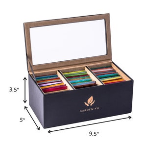 May include: Black tea bag storage box with a clear lid, 3 compartments, and a gold logo that says "GARDENIKA". The box measures 9.5 inches wide, 5 inches tall, and 3.5 inches deep.