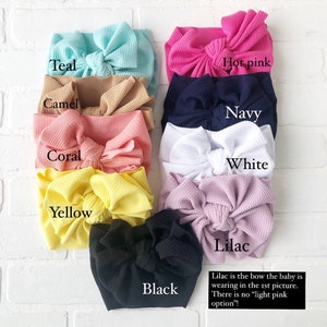 May include: A set of ten fabric headbands in various colors, including teal, camel, coral, hot pink, navy, white, yellow, black, and lilac. The text "Lilac is the bow the baby is wearing in the 1st picture. There is no "light pink option"!" is written below the headbands.