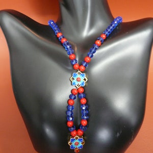 Blue Zirconia with Red beads and a Flower Pendant