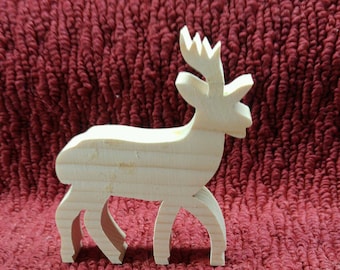 May include: A wooden reindeer figurine with a simple design. The reindeer is standing on a red textured surface.