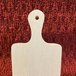 wood cutting board, 6" tall, 3 1/2" wide, 3/4" thick