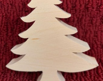 May include: A plain, unfinished wooden Christmas tree cutout. The tree is a simple silhouette with a flat base.