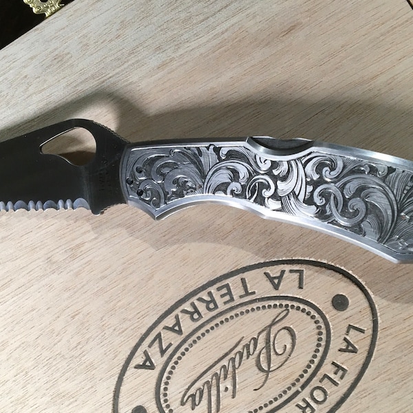 Hand engraved Spiderco CaraCara knife