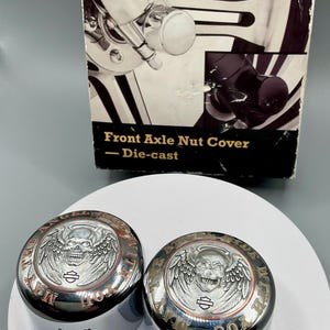 Harley Front Axle Nut Covers – Angel Skull Engraved Chrome Caps (Pair)