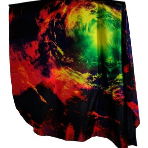 May include: A black fabric with a colorful nebula print. The print features shades of red, yellow, green, and blue. The fabric is draped over a surface.