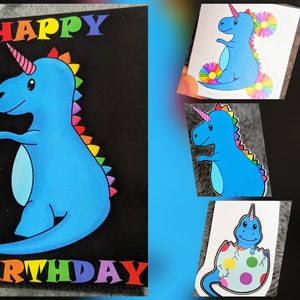 May include: A blue unicorn dinosaur with a rainbow mane and tail. The dinosaur is standing on a black background with the words "Happy Birthday" in rainbow letters.