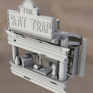 May include: A white wooden model of a shop with a sign that reads "The Rat Trap". The shop has a counter with various items on it, including a bottle, a phone, a loaf of bread, and a grinder.
