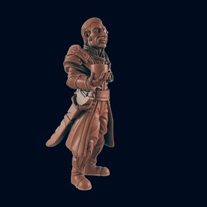 May include: A brown painted miniature figurine of a human character wearing a long coat and holding a cup. The character has a serious expression and is wearing a belt with a sword attached.