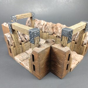 May include: A miniature wooden and stone dungeon set with metal accents. The set features a corner section with two wooden beams and metal brackets.