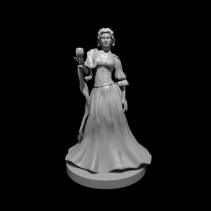 May include: A white figurine of a woman in a long dress holding a goblet. She has a crown and is wearing a corset.