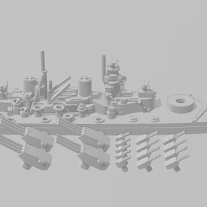 May include: A gray plastic model of a battleship with multiple cannons and a detailed hull. The model is disassembled and the cannons are laid out separately.