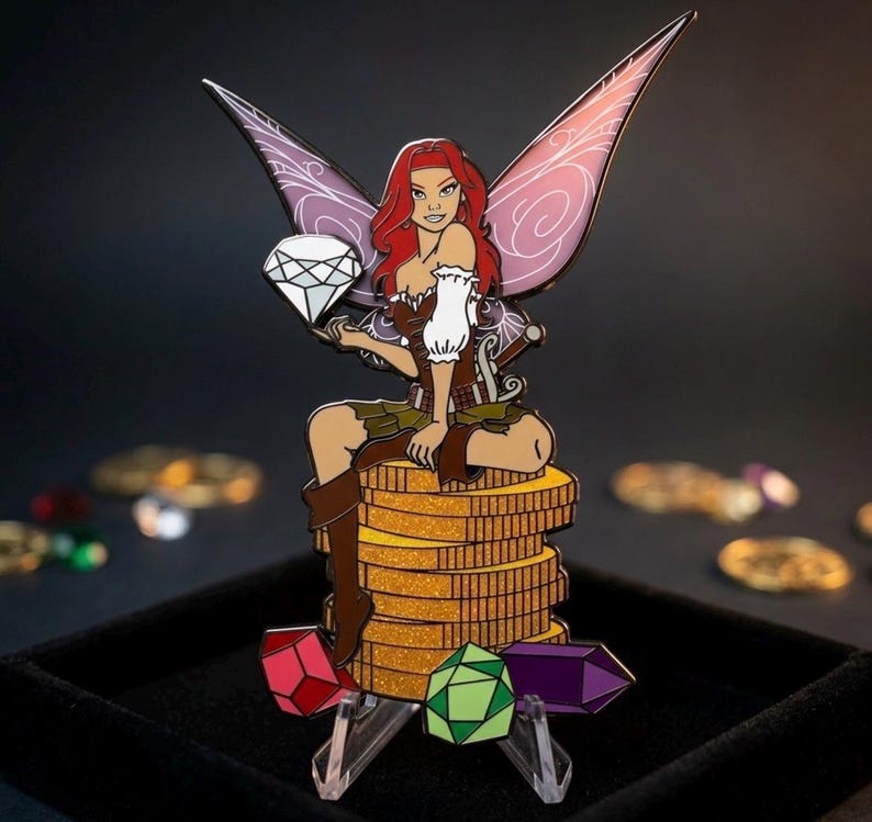May include: A fantasy-themed enamel pin featuring a red-haired fairy with purple and pink wings, holding a diamond. She sits atop a stack of gold coins, with colorful gems at the base. The pin has a detailed design and a black background.
