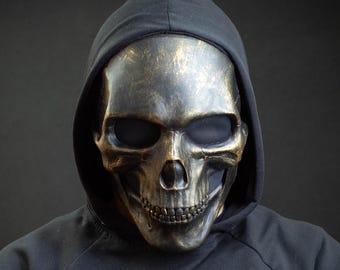 Black skull mask with gold scuffs for cosplay or gift
