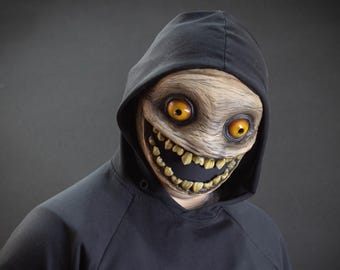 Crazy smile mask with yellow eyes for Halloween or a funny gift