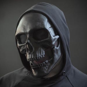 Human skull mask in black shape for cosplay or gift