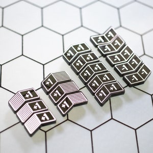 May include: A set of black and white plastic game pieces with the number "1" printed on them. The pieces are arranged in rows on a white hexagonal grid background.