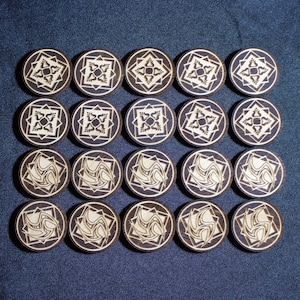 May include: Twenty-four wooden game pieces with intricate geometric designs. Each piece features a different pattern in black and white.