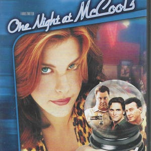 May include: DVD case for the movie "One Night at McCool's". The cover features a woman with red hair and blue eyes, and a snow globe with images of the male actors. The text reads "The Smartest and Funniest Comedy of the Year".