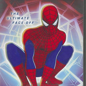 May include: DVD case for "Spider-Man: The New Animated Series." The cover features a crouching Spider-Man in a red and blue costume with a web design. The title and "The Ultimate Face-Off" are displayed.