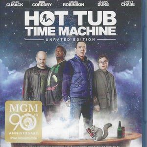 May include: A Blu-ray disc cover for the film Hot Tub Time Machine Unrated Edition featuring four actors standing behind a wooden hot tub with steam, a squirrel holding a red can, and an MGM 90th Anniversary gold sticker in the corner.