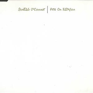 May include: A white CD case with the text "Sinéad O'Connor | Fire On Babylon" printed in green.