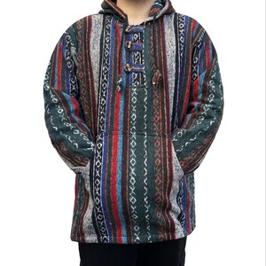 May include: A hooded sweater with a striped pattern in shades of green, red, blue, and white. The sweater has a drawstring hood and a front pocket.