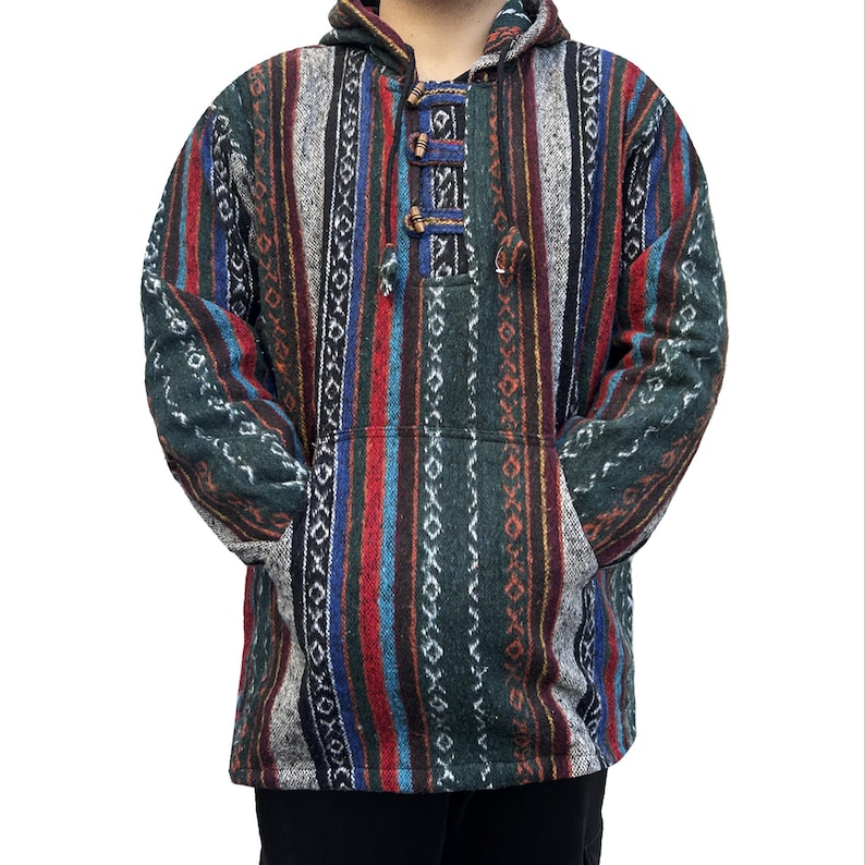 May include: A hooded sweater with a striped pattern in shades of green, red, blue, and white. The sweater has a drawstring hood and a front pocket.