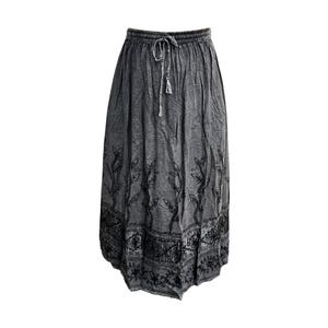 May include: A gray maxi skirt with a drawstring waist and a decorative black floral pattern along the hem and vertical accents. The skirt is made of a soft, flowing fabric, perfect for casual wear.