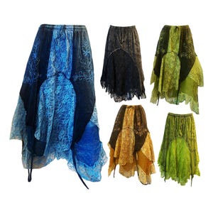 May include: A selection of asymmetrical skirts in shades of blue, black, gold, and green. Each skirt has lace panels and embroidered patterns. The skirts have drawstring waists and flowing, layered designs.