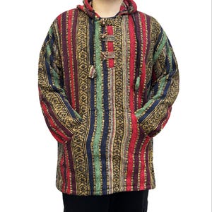 May include: A colorful striped hooded sweater with a drawstring closure. The sweater has a pocket on each side and is made of a soft, woven fabric.