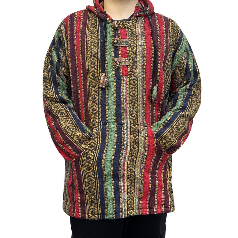 May include: A colorful striped hooded sweater with a drawstring closure. The sweater has a pocket on each side and is made of a soft, woven fabric.