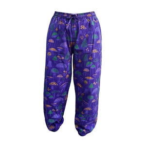 May include: Purple trousers with a mushroom print. The trousers have an elastic waistband and a drawstring.