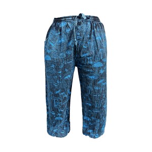 May include: Blue and black trousers with a mushroom print.