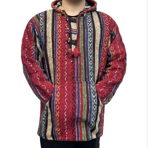 May include: A red, white, blue, and green striped hooded sweater with a drawstring. The sweater has a geometric pattern and a pouch pocket.