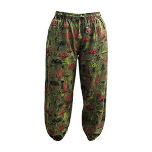 May include: Green trousers with a mushroom print. The mushrooms are red, green and black.