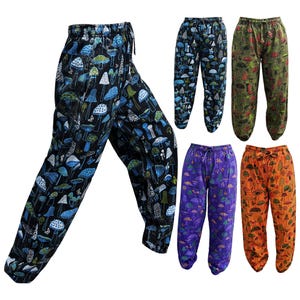 May include: Five pairs of printed trousers with a mushroom design. The trousers are in different colours, including blue, purple, orange, and green.