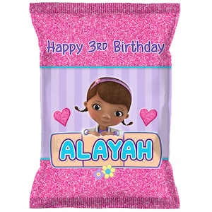 May include: Pink and purple birthday party favor bag with a cartoon doctor character and the text "Happy 3rd Birthday Alayah".