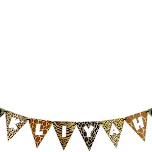 May include: A triangular banner with the name "KLIYAH" spelled out in white letters on a jungle animal print background. The banner has a "Happy Birthday" flag on each end with a cartoon mouse wearing a pink hat.