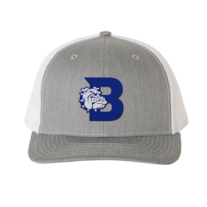 May include: A grey and white trucker hat with a blue and white bulldog logo. The logo features a bulldog with a blue "B" behind it.