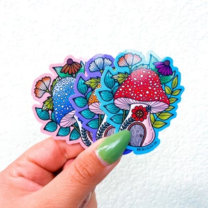 Puede incluir: Cuatro pegatinas de setas coloridas con un dise&ntilde;o caprichoso. Cada pegatina presenta una seta con una casa en su interior y una variedad de flores y hojas. Las pegatinas son perfectas para a&ntilde;adir un toque de fantas&iacute;a a cualquier proyecto.