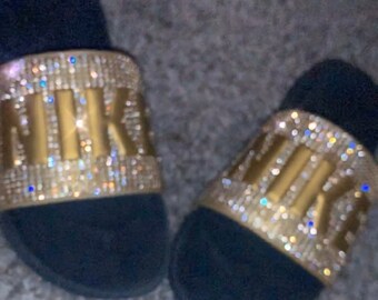 nike slides with gold check