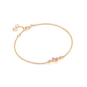 May include: A delicate gold chain bracelet with a small cluster of pink and white gemstones. The bracelet has a heart-shaped charm with the text "Forever & Ever" on it.